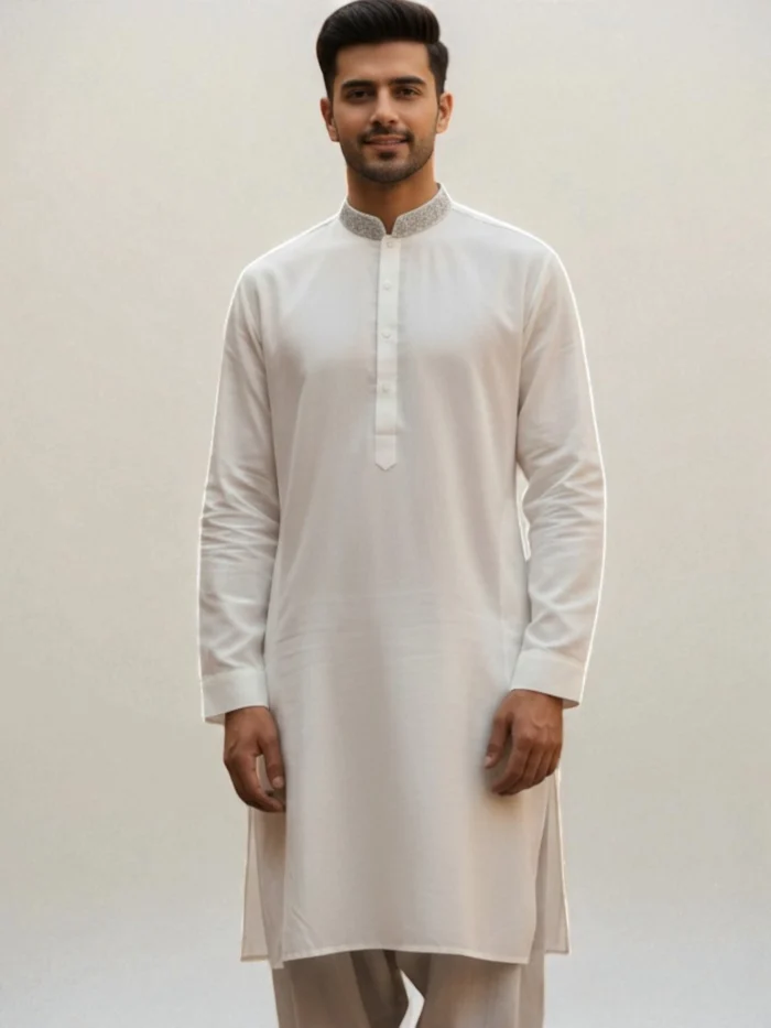 A crisp white kurta with a band collar adorned with subtle silver-gray embroidery.