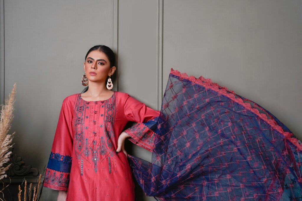 a women wearing a pink suit and showcasing her dupata