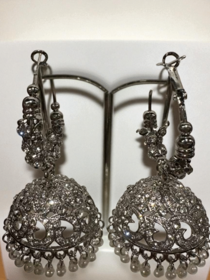 Pair of large silver plated Bali jhumka earrings heavily encrusted with clear rhinestones and finished with a fringe of small white pearls.