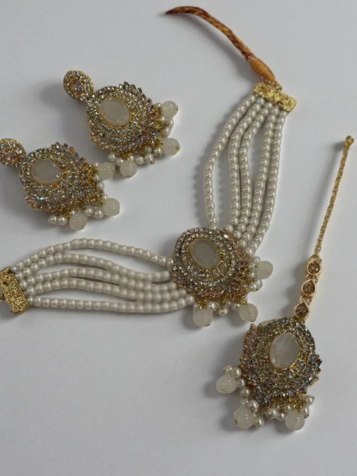 Gold plated choker set with multi-strand white pearls and a large Shell White/Opal oval center stone, with matching earrings and Maang Tikka,