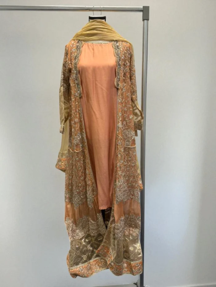 Long lavender chiffon jacket with heavy gold embroidery over a straight inner suit.
