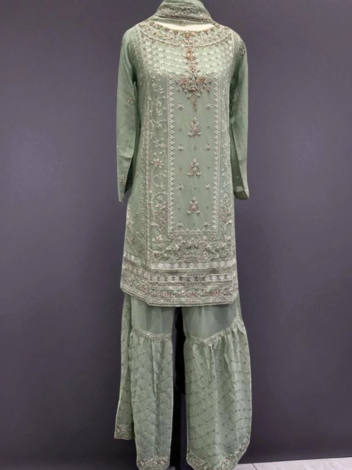 Mint green chiffon gharara suit with white thread embroidery, subtle floral hand work on the neckline, and voluminous tiered gharara pant