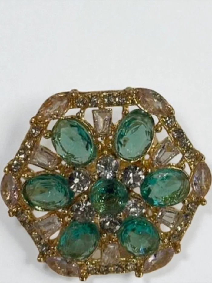 the ring with the same hexagonal floral cluster design.