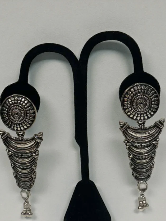 German Silver statement earrings with a circular stud and a large tiered V-shaped drop.