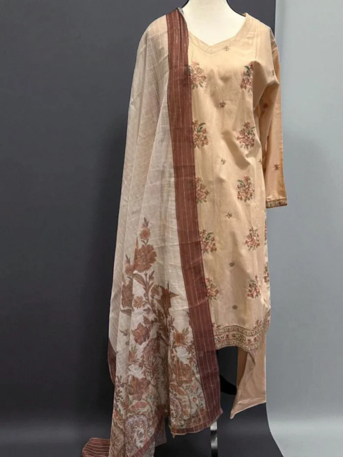 Mannequin wearing a light brown cotton Kurta with subtle floral embroidery, matching trousers, and a brown and white Doria printed dupatta with large floral motifs.